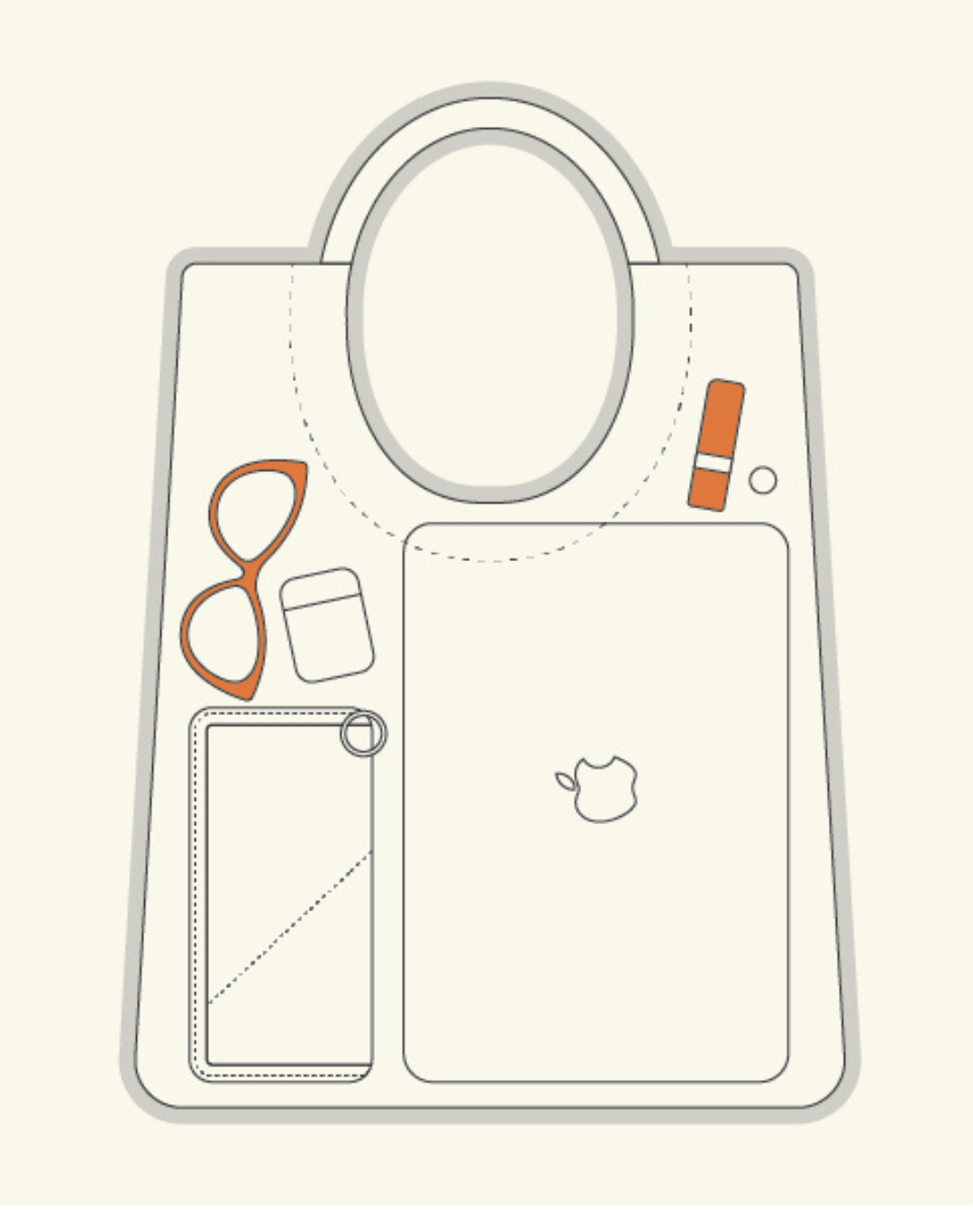 Mixed Emotions Reversible Tote in tan, showcasing organized inside with sunglasses, laptop, and phone.