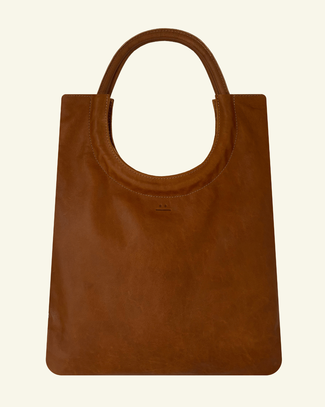 Mixed Emotions Reversible Tote in tan, handcrafted from suede and full-grain leather, perfect for versatile style.
