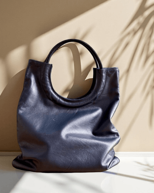 Mixed Emotions Reversible Tote in rich suede and leather, showcasing its stylish design and versatile colour, perfect for everyday use.