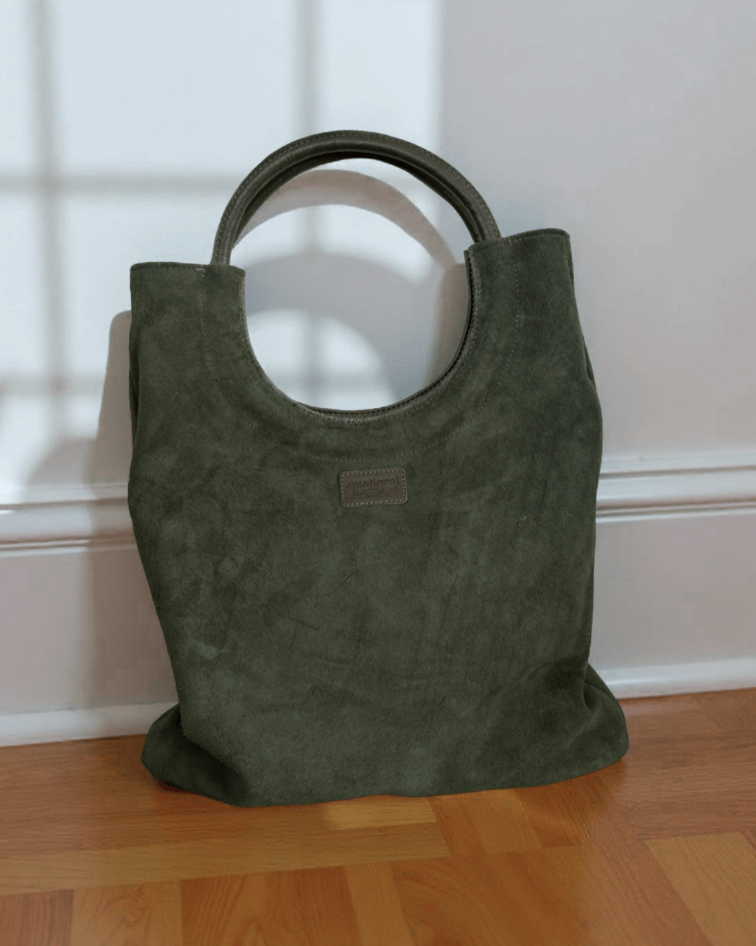 Mixed Emotions Reversible Tote in soft green suede, stylish and spacious for daily essentials.